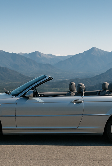 je veu tune image de bmw E46 decapotable grise clair , avec vue sur le coté , un ciel bleu et on est en bord de montage